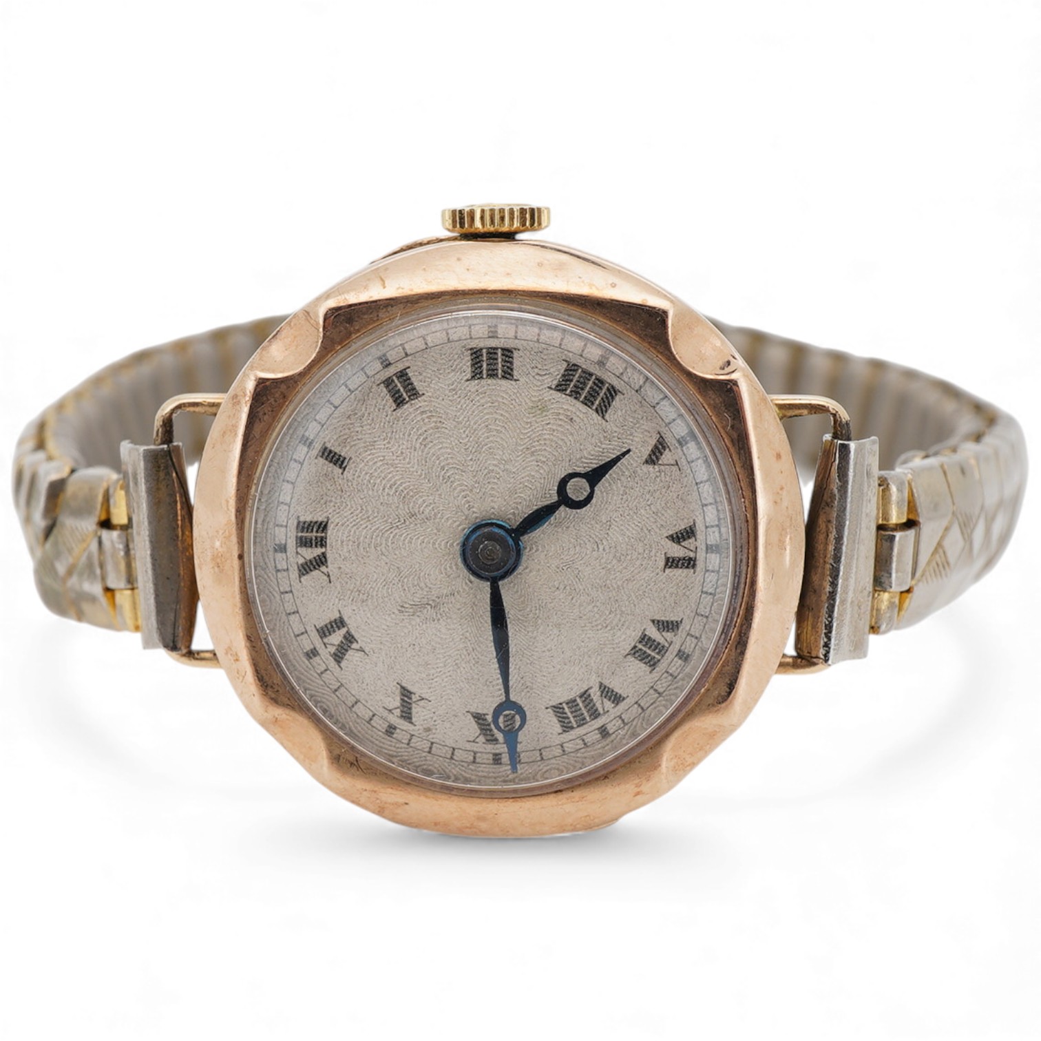 A lady's late 1920's 9ct gold manual wind wristwatch (a.f.), with sunburst Roman dial and unsigned movement, the winding crown with Tudor insignia, on an associated base metal flexible strap.